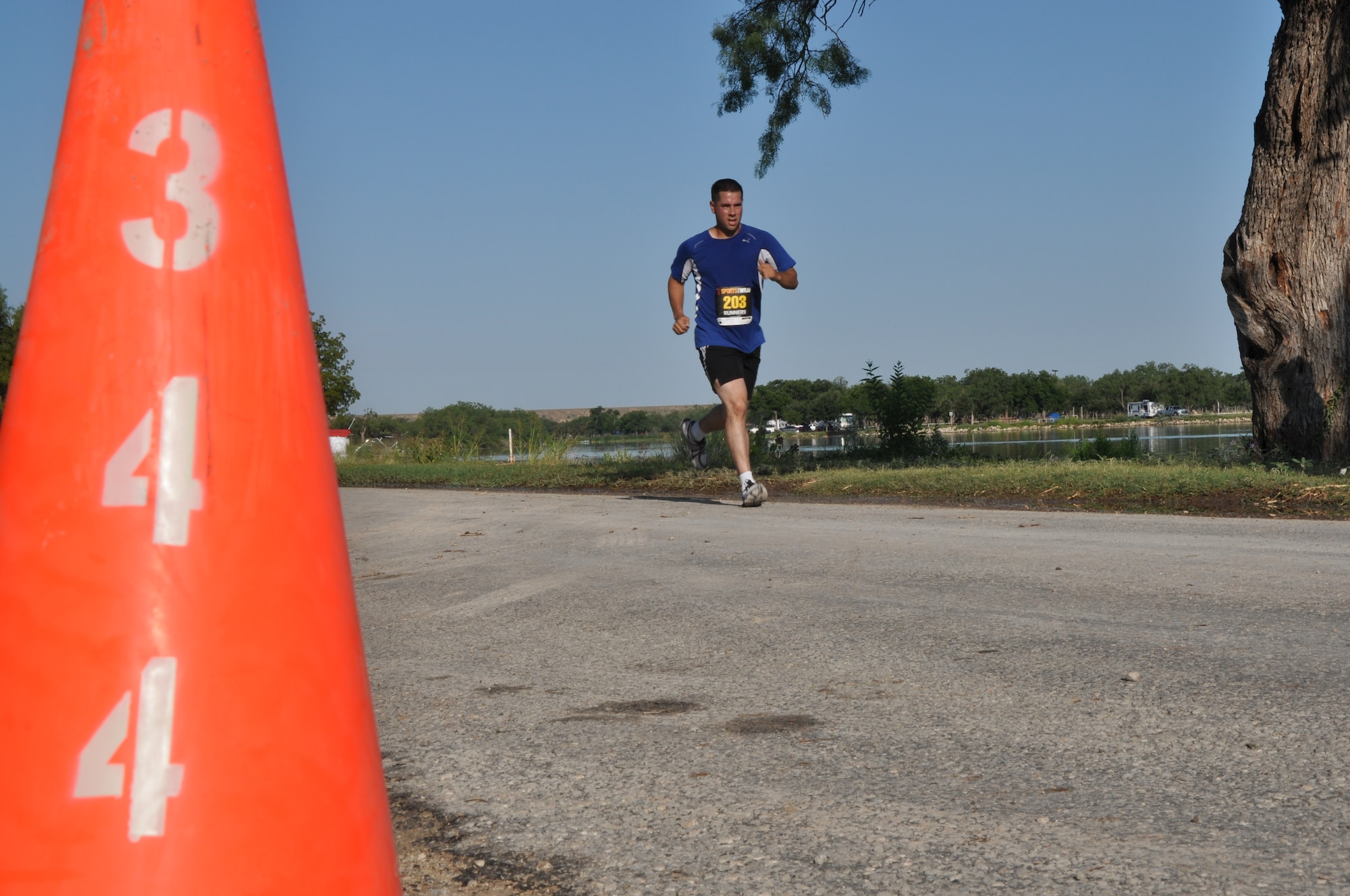 SAN ANGELO, Texas – Army Staff Sgt. Peter Jones, Army 344th Military Intelligence Battalion instructor, races toward the finish line during the 19th Annual Armydillo at the Spring Creek Marina and RV Park Aug. 24. Jones competed in the Armydillo 10k run.(U.S. Air Force photo/ Airman 1st Class Joshua Edwards)