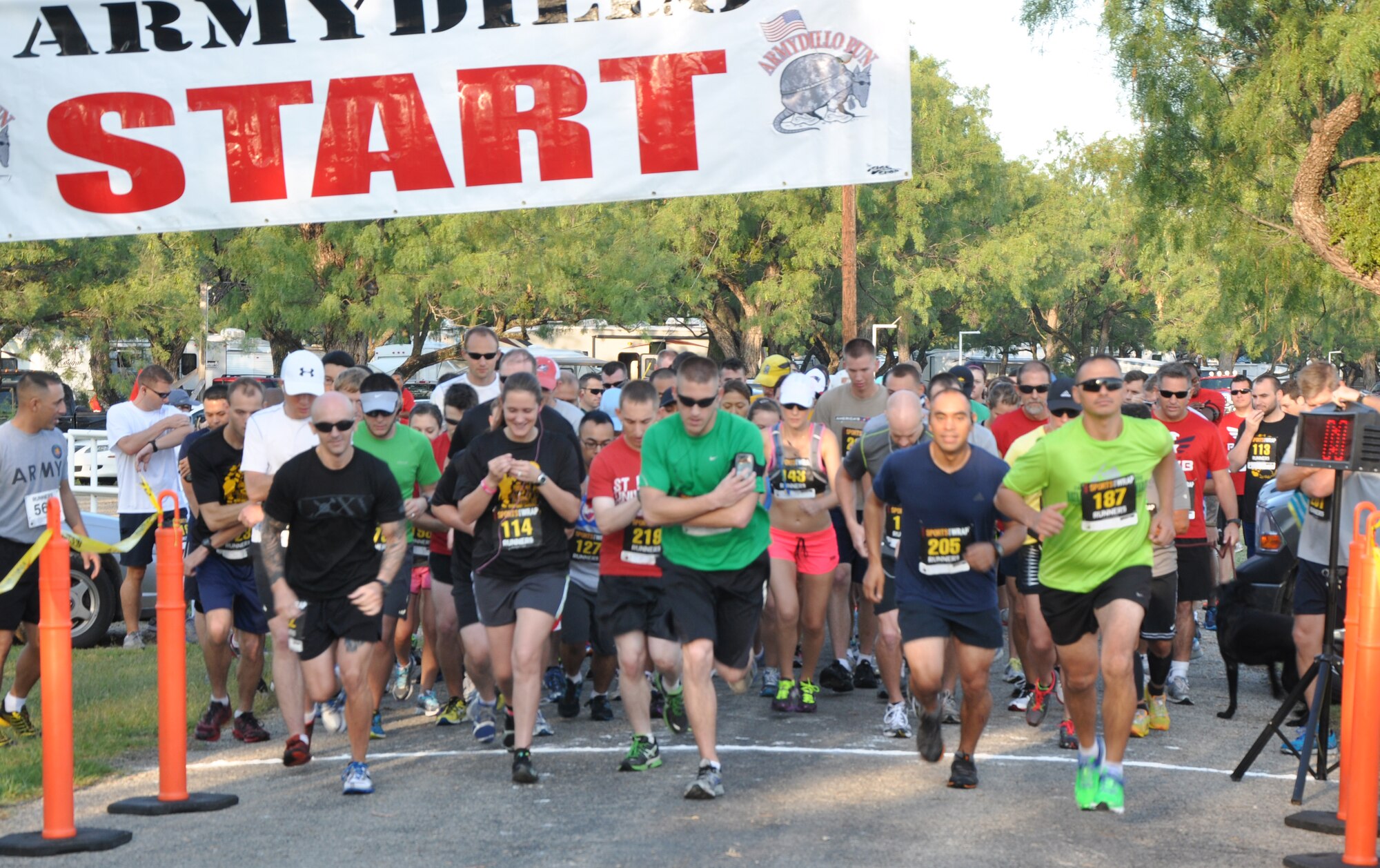 SAN ANGELO, Texas – Competitors for the Armydillo two-mile fun and 10k runs begin to race at the Spring Creek Marina and RV Park Aug. 24. The Armydillo was open to local civilians, active duty and retired military members. (U.S. Air Force photo/ Airman 1st Class Joshua Edwards)