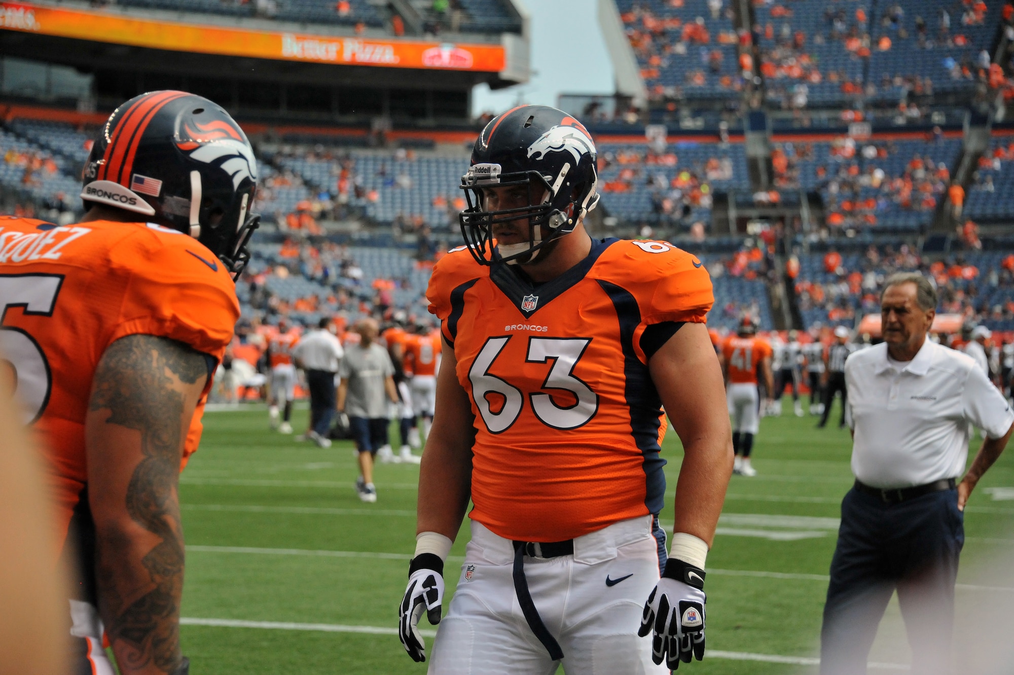 Air National Guard 1st Lt. Benjamin Garland (63), Denver Broncos Offensive Guard and 140th Wing Public Affairs Officer, performs warm up drills at Sports Authority Field at Mile High Stadium before a game in Denver, Colo. Aug 24, 2013. Garland, who originally entered the National Football League in 2010 after graduating from the U.S. Air Force Academy, was on the Bronco’s reserve/military list while fulfilling his active duty obligations in the Air Force. In 2012 Garland joined the Colorado Air National Guard and made the Broncos practice squad as a defensive lineman and is competing this season to make the 53 man final roster. (Air National Guard photo by Tech. Sgt. Wolfram M. Stumpf)
