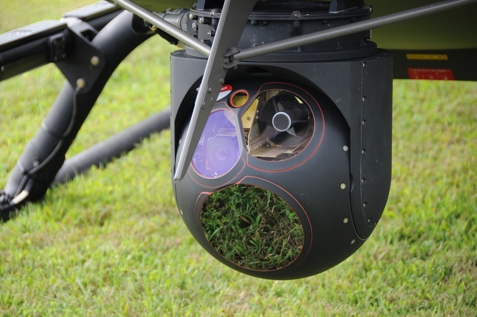 Attached to a UH-72 Lakota helicopter is a high-tech camera provided by the Virginia National Guard, Sandston-based Detachment 1, Company A, 2nd Battalion, 151st Aviation Regiment, 21 August.  Signals from this camera travel to Airmen on the ground from the 192nd Fighter Wing, 192nd Intelligence Squadron, who partnered with the National Guard and state police to prepare images for state agency customers. (U.S. Air National Guard photo by Master Sgt. Carlos Claudio).