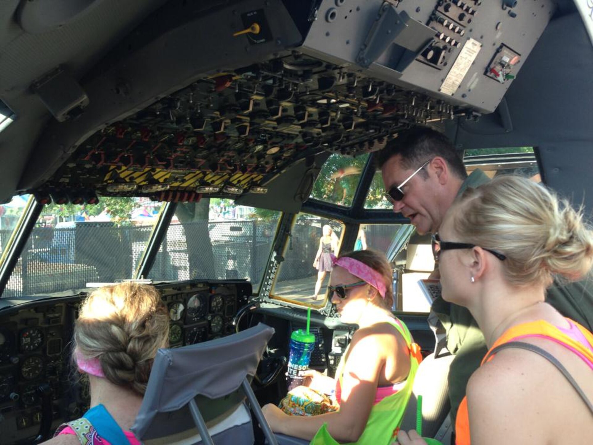 Master Sgt. James Courneya, 96th Airlift Squadron loadmaster, talks about the C-130 aircraft inside the flight deck display at the Minnesota State Fair's Military Appreciation Day Aug. 27. (Air Force Photo/Tech. Sgt. Kimberly Hickey)
