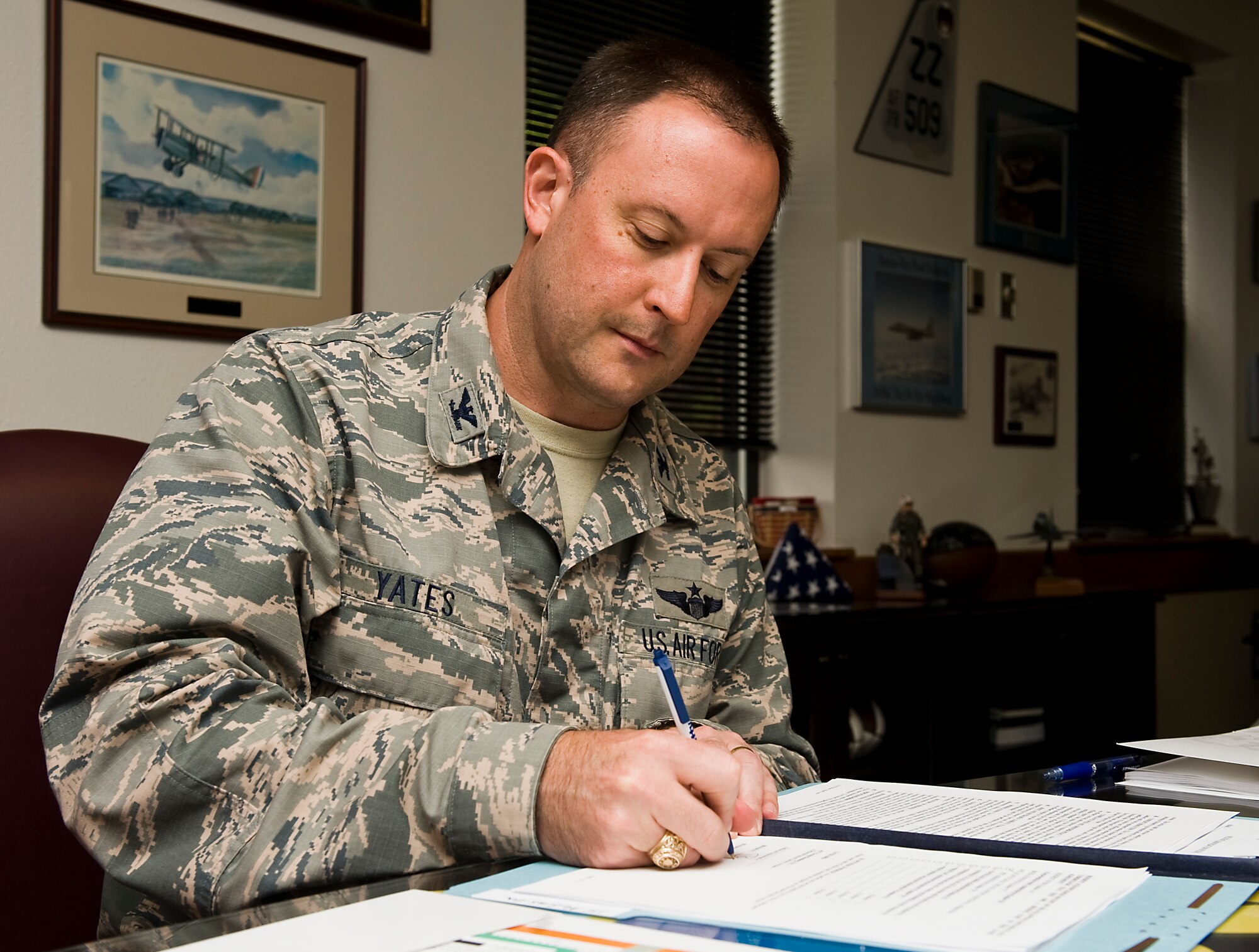 U.S. Air Force Col. Brian Yates, 7th Mission Support Group commander, signs his on-base housing lease Aug. 27, 2013, at Dyess Air Force Base, Texas. Balfour Beatty Communities has been awarded the contract to Dyess’ base housing area. The company’s goal is to provide Dyess Airmen with superbly planned and designed communities and professional and responsive support to residents. (U.S. Air Force photo by Senior Airman Peter Thompson/Released)