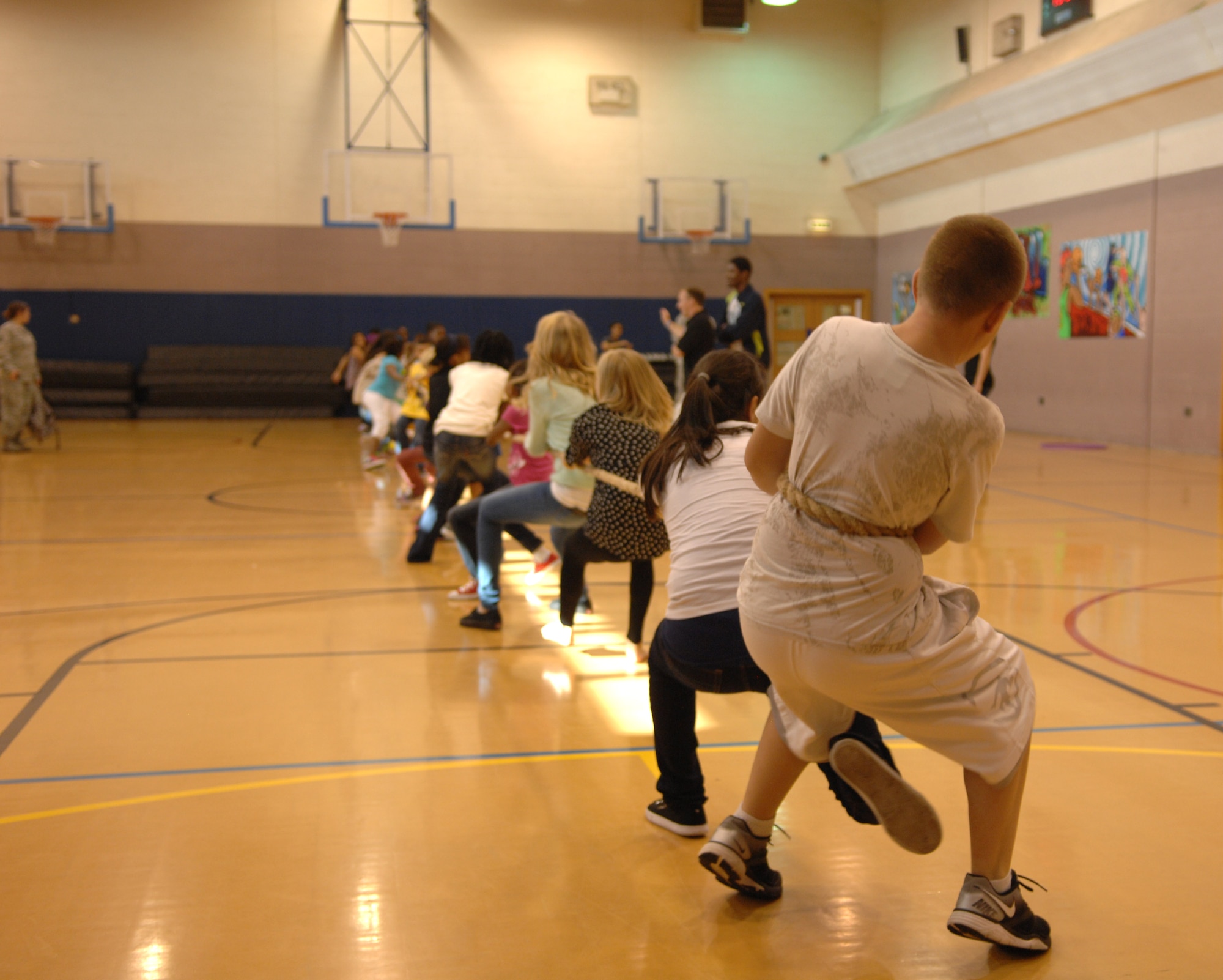 Team Mildenhall children play tug-of-war Aug. 26, 2013, as part of a women’s equality celebration at the youth center on RAF Mildenhall, England. Children participated in numerous activities, all the while learning facts about women’s equality. The day was geared toward educating children about the differences in women’s rights through history while having fun. (U.S. Air Force photo by Airman 1st Class Dillon Johnston/Released)