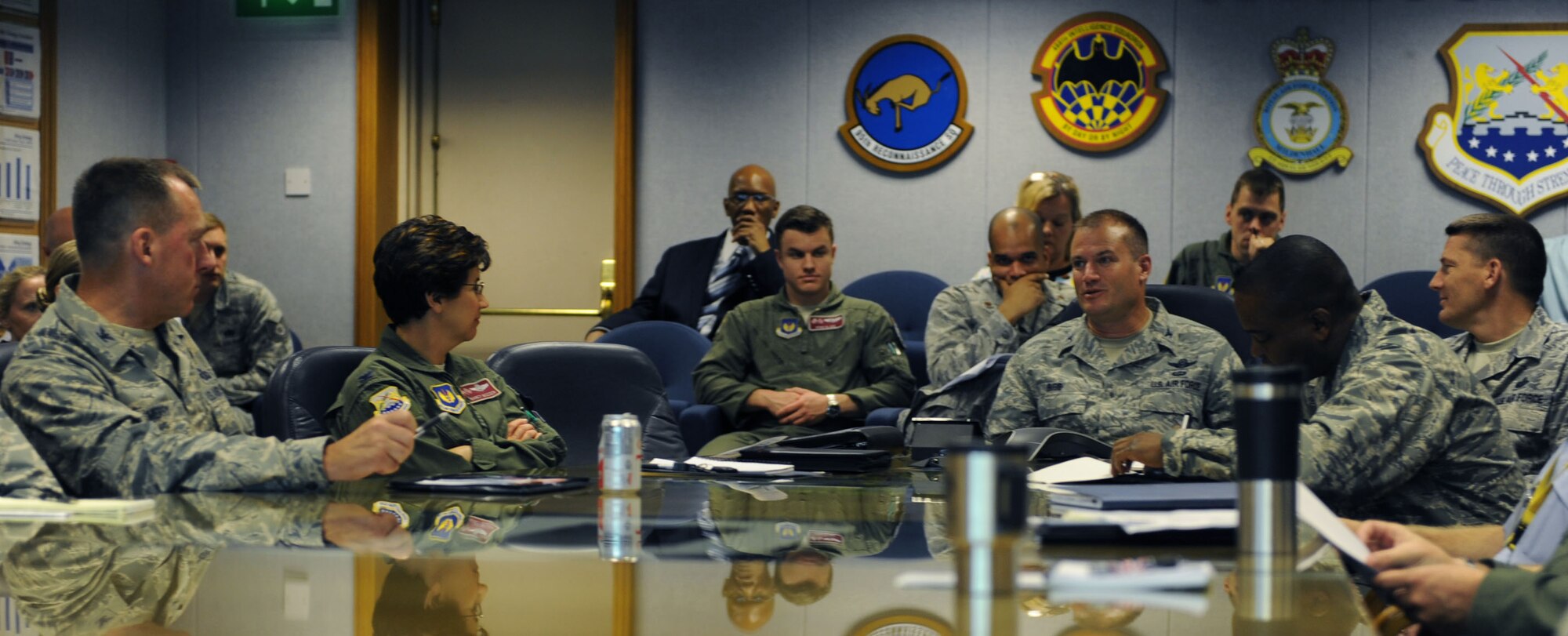 U.S. Air Force Col. Kenneth T. Bibb Jr., center right, 100th Air Refueling Wing commander, addresses base topics of discussion during the 100th ARW staff meeting Aug. 28, 2013, on RAF Mildenhall, England. After taking command of the 100th ARW, Bibb made it clear he intends to maintain the high level of excellence which defines Team Mildenhall. Bibb believes the key to mission success is readiness as individual Airmen, squadrons, and as a wing. (U.S. Air Force photo by Airman 1st Class Preston Webb/Released)