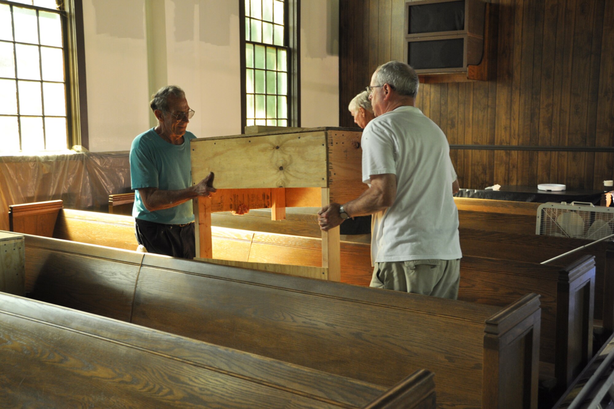 Col. (Ret.), John Powers, chairman of the Dobbins Chapel Foundation, and volunteers help paint and renovate the former Dobbins Chapel during Project B.Y.O.B. (Bring Your Own Brush) Aug. 24. The chapel, now located at the Clay National Guard Center in Marietta, Ga., has been going through renovation since its move from Dobbins March 17. (U.S. Air force photo/James Branch)