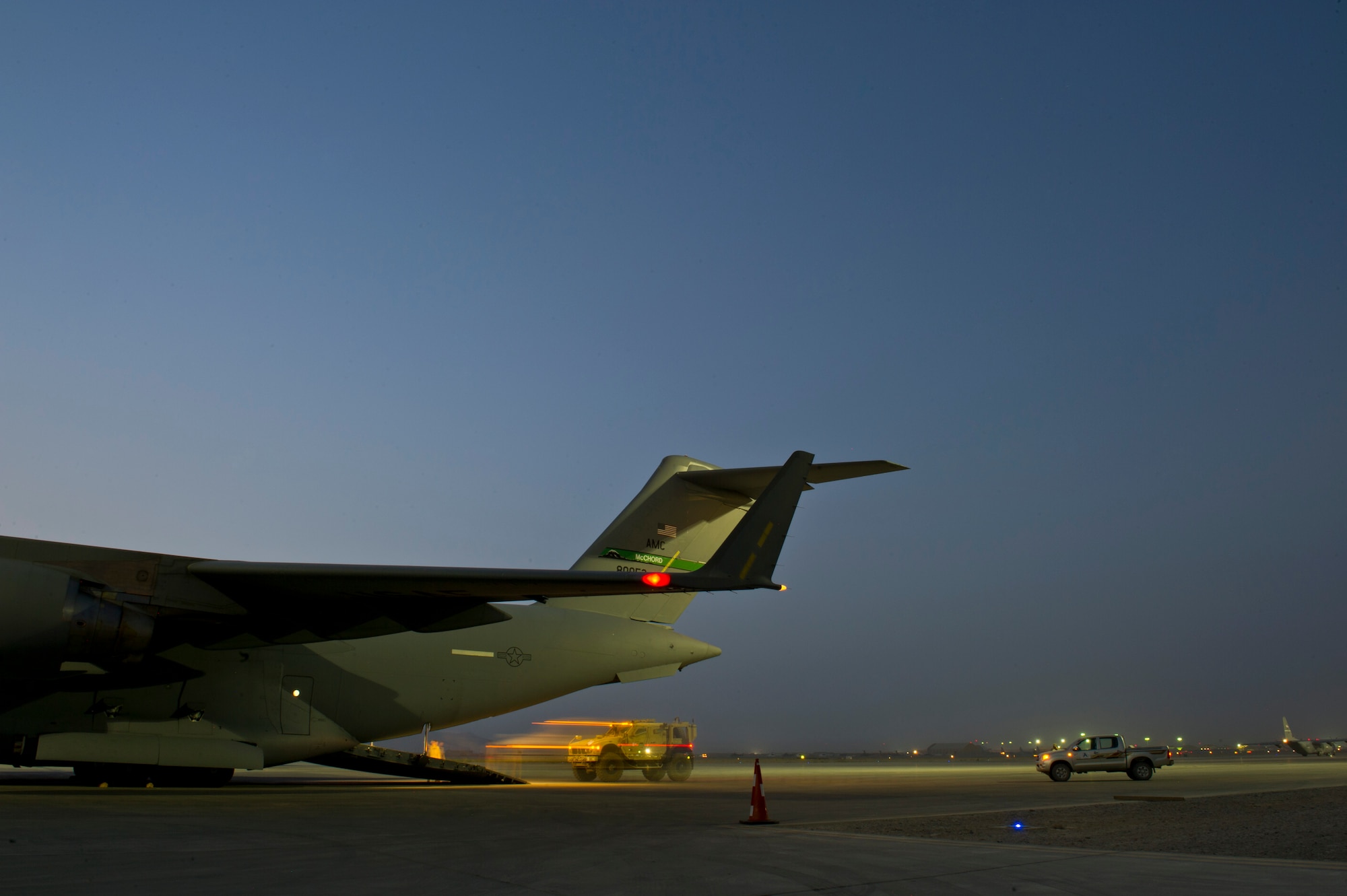Members from the 316th Expeditionary Airlift Squadron, load military vehicles onto a C-17 Globemaster III during an airlift mission, July 26, 2013, Kandahar Air Field, Afghanistan. The C-17 is capable of rapid strategic and tactical delivery of troops and any type of cargo around the Central Command area of reasonability. The aircraft can perform airlift, airdrop, and transport ambulatory patients during aeromedical evacuations when required. (U.S. Air Force photo/Staff Sgt. Marleah Miller)