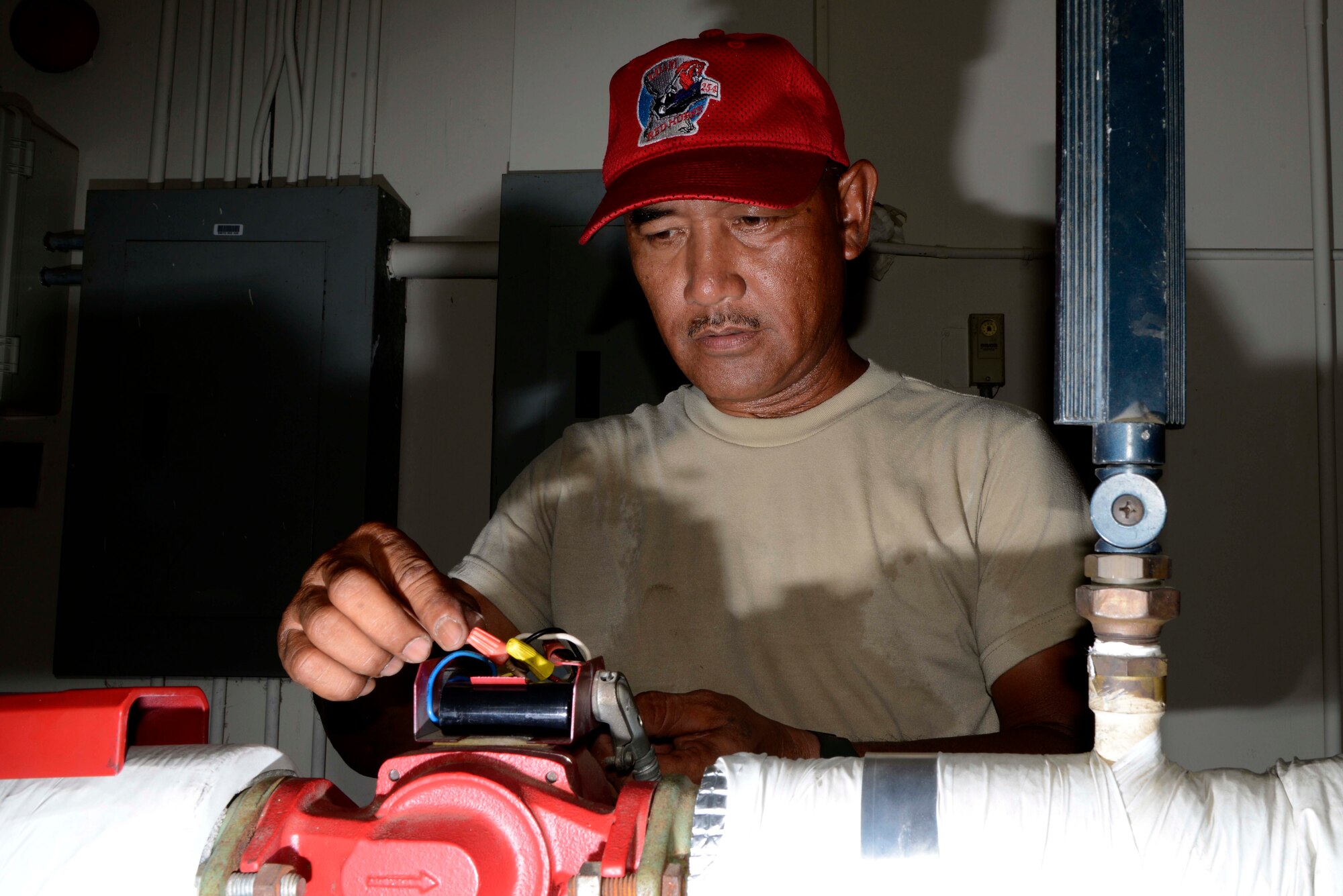 U.S. Air Force Staff Sgt. Edward Fernandez, 254th  RED HORSE Squadron structure craftsman, troubleshoots a plumbing unit at Rush Park, Osan Air Base, Republic of Korea, during the Ulchi Freedom Guardian 2013 exercise, Aug. 18, 2013. The 254th RHS has been preparing and supporting the UFG since 2006  ensuring participants have essential water, heat and electrical power generation. UFG is an annual training, defense-oriented exercise developed around realistic scenarios designed to defend the ROK, protect the region, and maintain stability on the Korean Peninsula. (U.S. Air Force photo/Staff Sgt. Sheila deVera