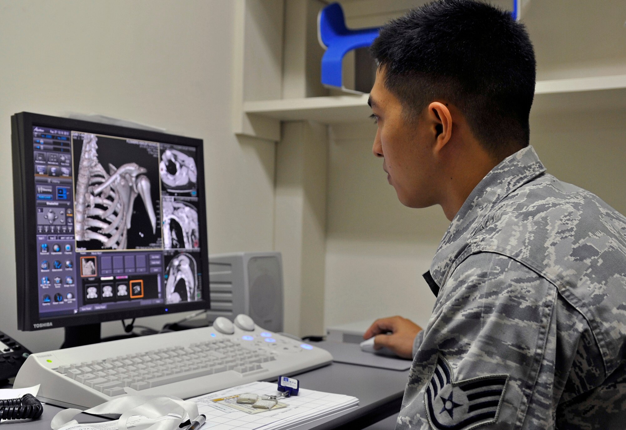 U.S. Air Force Staff Sgt. Mark Lagman, 35th Surgical Operations Squadron diagnostic imaging technologist, analyzes a patient’s CT scan for any breaks or fractures at Misawa Air Base, Japan, Aug. 27, 2013. On this screen, technologists have the option to view the patient’s bones, lungs, or muscles in a 3-D image. (U.S. Air Force photo by Airman 1st Class Zachary Kee)
