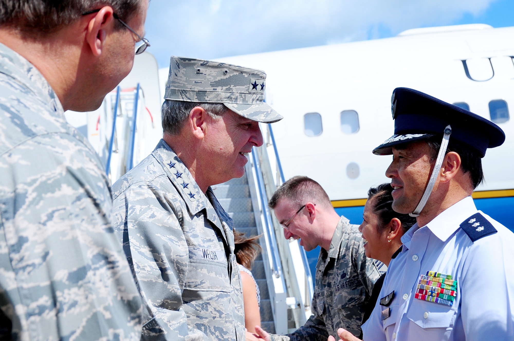 Air Force Chief of Staff Gen. Mark A. Welsh III is greeted by Lt. Gen. Tetsuo Morimoto, Northern Air Defense Force commander, upon his arrival to Misawa Air Base, Japan, Aug. 28, 2013.  During Welsh’s visit, his first to Misawa as the CSAF, he toured various locations on base and met with hundreds of Misawa Airmen. 