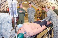 Maj. Stephen Baffic, Homeland Response Force surgeon with the 116th Air Control Wing, briefs Lt. Gen. Stanley E. Clarke III, director of the Air National Guard, during a hands-on demonstration by the 116th Medical Group's Chemical, Biological, Radiological, Nuclear and Explosives Enhanced Response Force.