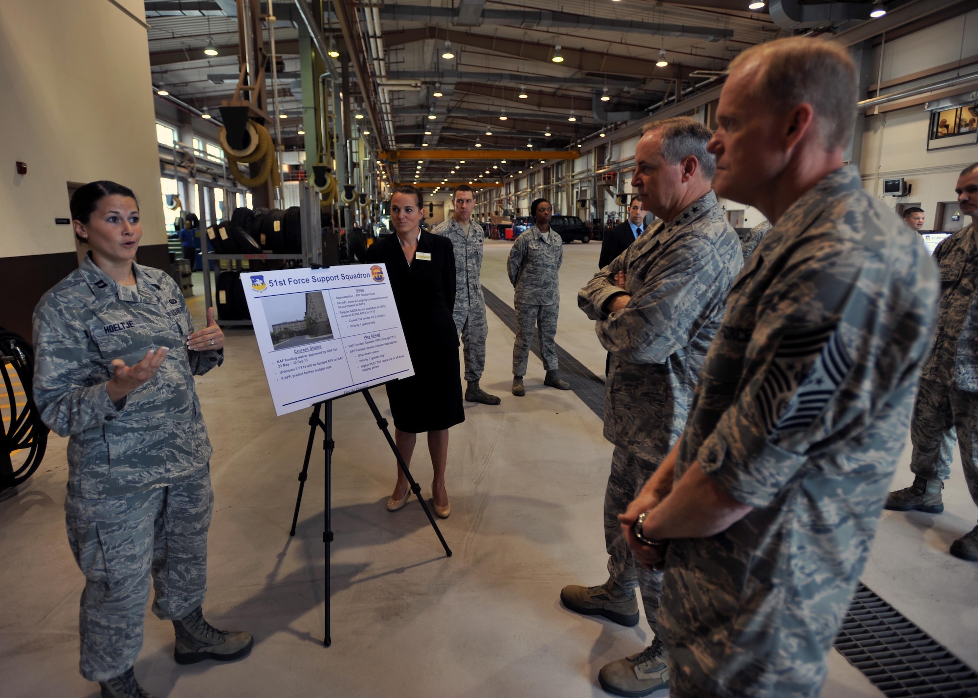 Capt. Elizabeth Hoeltje (left) briefs Chief Master Sgt. of the Air Force James A. Cody and Air Force Chief of Staff Gen. Mark A. Welsh III  Aug. 23, 2013, at Osan Air Base, South Korea. Welsh and Cody spent two days at Osan AB during their first visit to the Pacific Air Forces. Hoeltje is a sustainment flight chief with the 51st Force Support Squadron. (U.S. Air Force photo/Senior Airman Siuta B. Ika) 