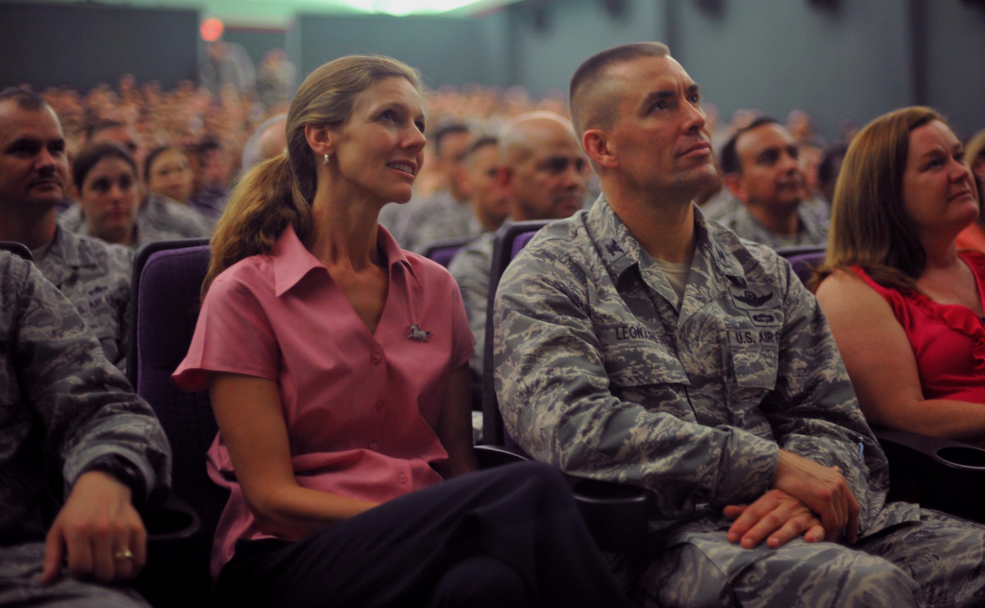 Col. Brook Leonard (right) and his wife Maria, listen to Air Force Chief of Staff Gen. Mark A. Welsh III and Chief Master Sgt. of the Air Force James A. Cody speak during an Airman’s call Aug. 22, 2013 at Osan Air Base, South Korea. Welsh and Cody thanked Airmen for their continued service and dedication, and issued their three keys to success: common sense, communication and caring. Leonard is the 51st Fighter Wing commander.
