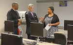 Secretary of the Army John McHugh, center, and District of Columbia National Guard Commander Maj. Gen. Errol R. Schwartz meet Terri Jones, Distance Learning manager for the D.C. National Guard, at the D.C. Armory, July 12, 2013.