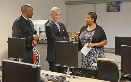 Secretary of the Army John McHugh, center, and District of Columbia National Guard Commander Maj. Gen. Errol R. Schwartz meet Terri Jones, Distance Learning manager for the D.C. National Guard, at the D.C. Armory, July 12, 2013.