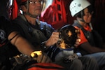 El Paso County Search and Rescue K-9 Tucker watches as the Colorado National Guard CH-47 Chinook he is in takes off for an exercise search and rescue mission at the U.S. Air Force Academy during a Vigilant Guard exercise scenario, July 22, 2013.