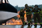 U.S. Army Reserve firefighters work to put out a fire at Volk Field Combat Readiness Training Center in Camp Douglas, Wis., July 18, 2013, during exercise Patriot 13.