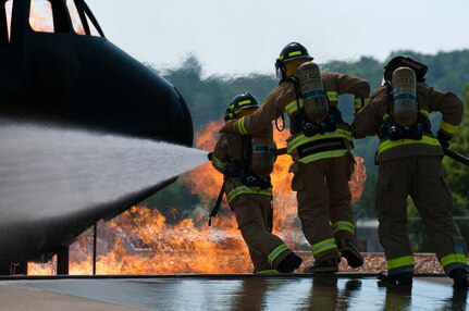 U.S. Army Reserve firefighters work to put out a fire at Volk Field Combat Readiness Training Center in Camp Douglas, Wis., July 18, 2013, during exercise Patriot 13.