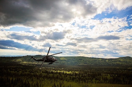 An Alaska Air National Guard HH-60 Pave Hawk helicopter from the 210th Rescue Squadron is on a training flight July 10 in Southcentral Alaska. Rescuers run an average of five missions a week.