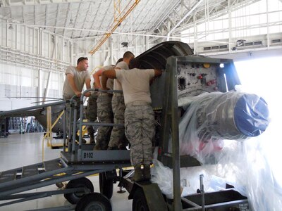 A Kentucky Air National Guard member works on a C-130 Hercules engine at the Air National Guard Combat Readiness Training Center in Gulfport, Miss., on June 18, 2013, as part of a week-long course called Maintenance University.