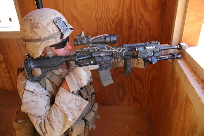 MARINE CORPS AIR GROUND COMBAT CENTER TWENTYNINE PALMS, Calif. – Lance Cpl. Benjamin Fulk, rifleman, 3rd Battalion, 7th Marine Regiment, provides suppressing fire as his squad maneuvers around the enemy during the Integrated Training Exercise here, Aug. 12, 2013. Fulk, 19, a native of Scottsbluff, Neb., successfully pinned down the enemy as his Marines moved to apprehend a target. The Marines assume a supporting role while deployed to Afghanistan by letting the ANA and the Afghan National Police lead in combat operations. The ITX is a training exercise held to prepare Marines prior to their upcoming deployment to Afghanistan.