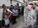 Rocco Jones, 3, left, cheers for his older brother PV2 Joseph Jones at the end of a departure ceremony for the 150th Engineers, New Jersey Army National Guard. The horizontal engineer company from Hammonton departed Joint Base McGuire-Dix-Lakehurst on Monday, starting a deployment to Afghanistan.