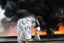 Marines with Bulk Fuel Company, 8th Engineer Support Battalion, 2nd Marine Logistics Group conducted annual live fire training aboard Marine Corps Air Station Cherry Point, Aug. 28, 2013. During the training more than 200 gallons of fuel were poured into a circular pit and then ignited to simulate an actual incident.  (U.S. Marine Corps photo by Lance Cpl. Shawn Valosin)