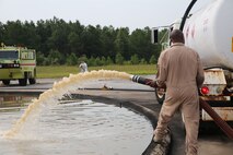 More than 200 gallons of fuel were poured into a circular pit and then ignited during a live fire training exercise aboard Marine Corps Air Station Cherry Point, Aug. 28, 2013. Marines with Bulk Fuel Company, 8th Engineer Support Battalion, 2nd Marine Logistics Group participated in the live fire exercises as well as classroom instruction on fuel first aid as part of their annual training requirement. (U.S. Marine Corps photo by Lance Cpl. Shawn Valosin)