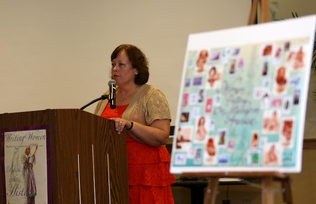 Theresa Van Dam, contract dental assistant at Marine Corps Recruit Depot Parris Island Dental Clinic, speaks about her struggles while serving in the Marine Corps at the Women's Equality Day special event aboard Marine Corps Air Station Beaufort, Aug. 22.