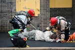 New York Army National Guard Soldiers from the search and extraction element of the Chemical, Biological, Radiological and Nuclear enterprise evaluate a simulated casualty during a disaster response exercise Aug. 9, 2013, at the Westchester County Fire Training Center.