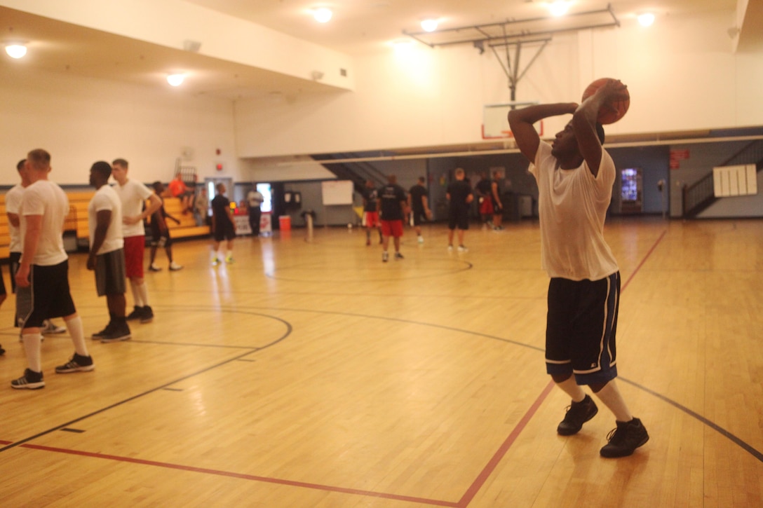 Lance Cpl. Quentin L. Posey, a Company A clerk, shoots the basketball while preparing for the final game versus Company I during the monthly Commander’s Challenge at the Area 1 gym aboard Marine Corps Base Camp Lejeune, Aug. 22. Company I won the challenge, taking home the trophy. 