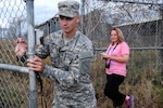 Kentucky Army National Guard Private 1st Class Cody Cooper, a member of the 133rd Mobile Public Affairs Detachment from Scottsville, Ky., escorts news media representatives during a tour of Camp X-Ray at Guantanamo Bay, Cuba, Aug. 8, 2013. Camp X-Ray was the first detention camp at Guantanamo Bay.