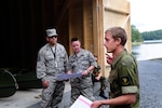 Norwegian Military Academy Cadet Kjetil Waal, a senior Royal Norwegian military cadet enrolled in the engineering program at the Norwegian Military Academy (Krigsskolen), at Camp Linderud, in Oslo, Norway, briefs members of the Texas Air National Guard's 149th Civil Engineering Squadron, on a construction project at Rygge Air Station, Norway. The 149th CES was in Norway as part of the deployment for training program to train with members of the Royal Norwegian armed forces.