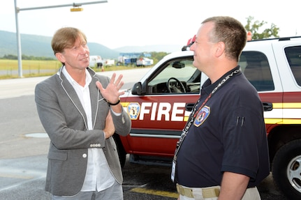 Lithuanian Col. Arturas Rackauskas, left, deputy director of the fire and rescue department of Lithuania, and Bob Edmiston, Fort Indiantown Gap fire chief, discuss different aspect of firefighting during a tour of the fire station at Fort Indiantown Gap. The tour was part of planning discussions for Vigilant Guard, an emergency-preparedness exercise hosted by the Pennsylvania National Guard that is scheduled to include Lithuanian military and rescue personnel as part of the partnership between the Pennsylvania Guard and Lithuania through the National Guard Bureau's State Partnership Program.