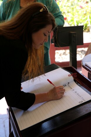 MARINE CORPS BASE CAMP PENDLETON, Calif. – General Alexander A. Vandegrift’s great granddaughter, Serina Vandegrift, signs into a guest book at the Ranch House museum during a visit here, Aug. 27, 2013. General Vandegrift was the 18th commandant of the Marine Corps and the first Marine officer on active duty to attain four-star rank.
