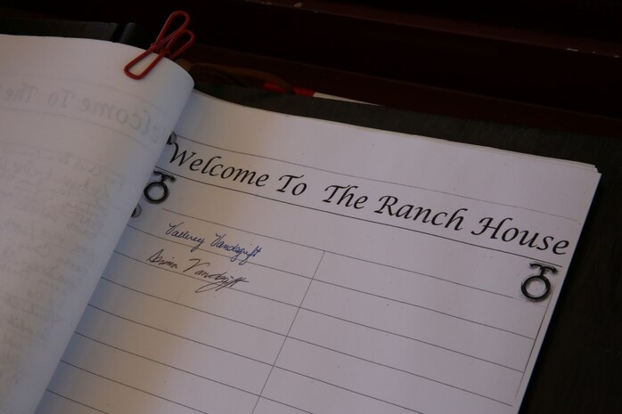 MARINE CORPS BASE CAMP PENDLETON, Calif. – General Alexander A. Vandegrift’s granddaughter and great granddaughter, Vallerey and Serina Vandegrift, sign into a guest book at the Ranch House museum during a visit here, Aug. 27, 2013. General Vandegrift was a Medal of Honor recipient and commanded the division during 1942 in its first ground offensive of World War II, the Battle of Guadalcanal.