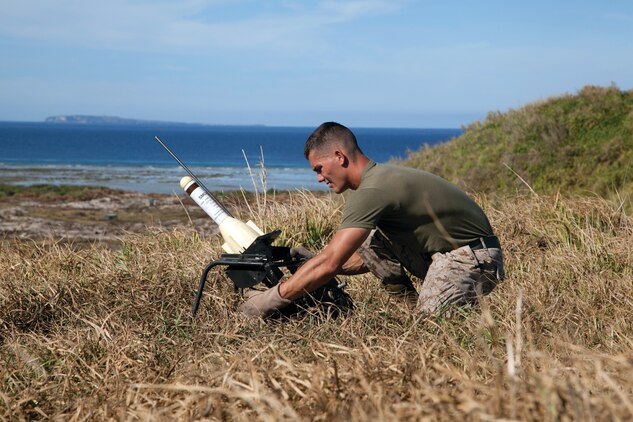 Lance Cpl. Bradley J. Vicchiollo prepares a Smokey SAM rocket Aug. 27 on a training island off the coast of Ie Shima. Vicchiollo is an aviation ordnance technician with Marine Aerial Refueler Transport Squadron 152, Marine Aircraft Group 36, 1st Marine Aircraft Wing, III Marine Expeditionary Force. 