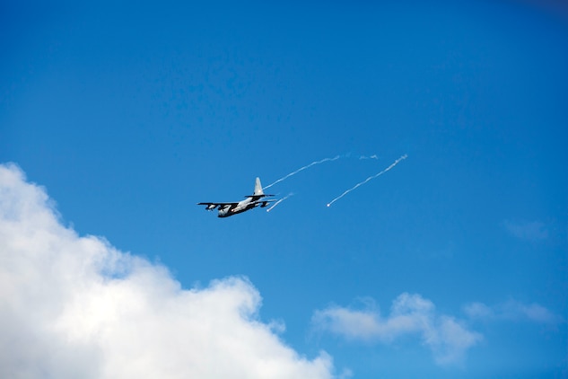 A KC-130J Super Hercules releases flares Aug. 27 above a training island off the coast of Ie Shima. The flares are used to create new heat signature decoys for heat-seeking missiles to follow. The KC-130Js are with Marine Aerial Refueler Transport Squadron 152, Marine Aircraft Group 36, 1st Marine Aircraft Wing, III Marine Expeditionary Force. 
