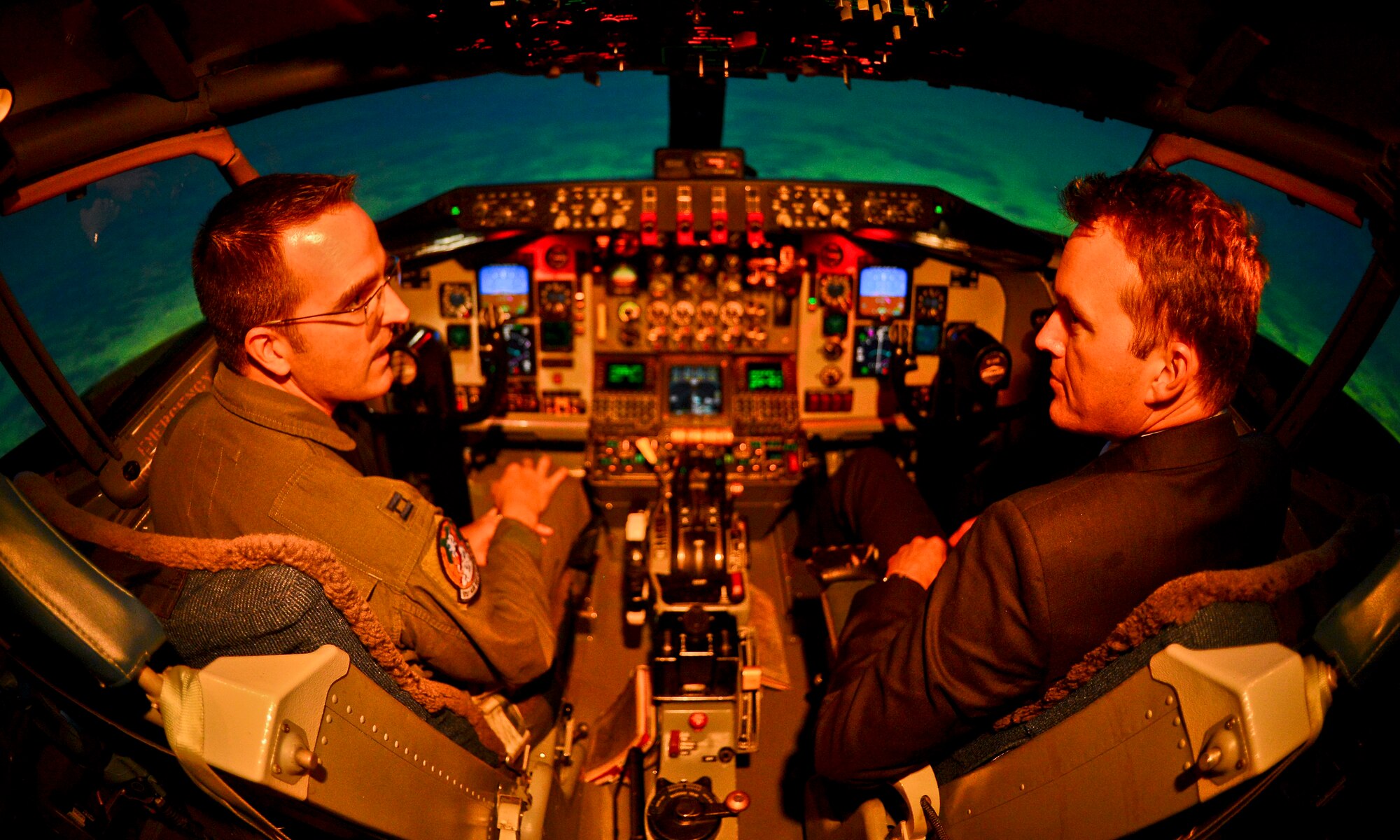 Acting Secretary of the Air Force Eric Fanning receives KC-135 Stratotanker simulator lessons from Capt. Steven Whitson, a pilot instructor at MacDill Air Force Base, Fla., Aug. 29, 2013. The use of simulators is becoming more important to ensure readiness due to increasing budget constraints. (U.S. Air Force photo by Ned T. Johnston/Released)