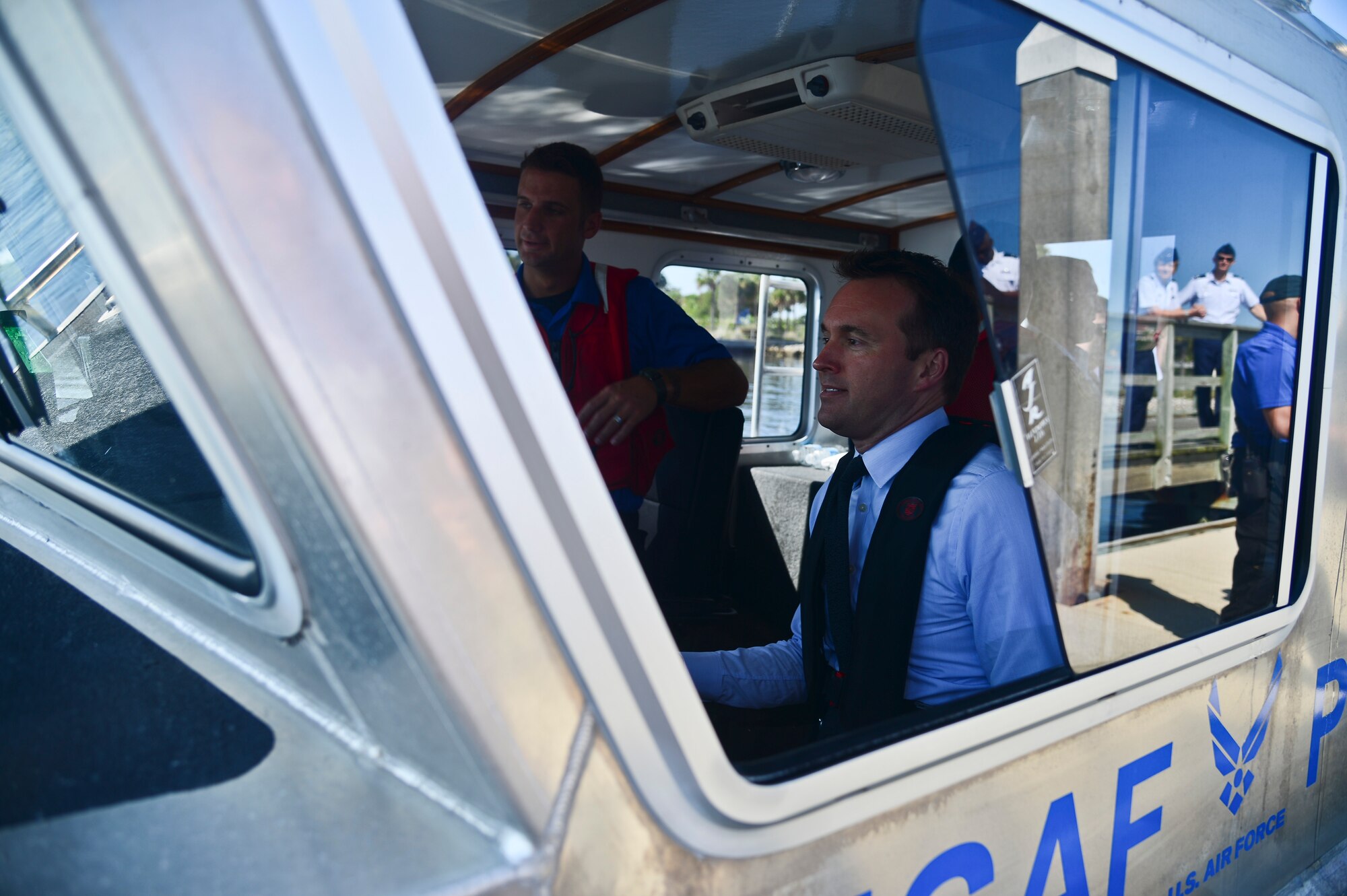 The Acting Secretary of the Air Force Eric Fanning sits behind the wheel of a marine patrol boat with Airmen of the 6th Security Forces Squadron at MacDill Air Force Base, Fla., Aug. 29, 2013. Fanning was taken out with the marine patrol for a tour of MacDill from Tampa Bay, as well as an insight into the job these Airmen do. (U.S. Air Force photo by Airman 1st Class Ned T. Johnston/Released)