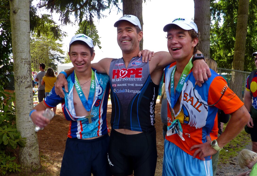 Lt. Col. Roger Zander (middle), 728th Airlift Squadron instructor pilot and Hawaiian Airlines pilot, poses with his sons Vernon (left) and Zach (right) after completing an Ironman Triathlon at Lake Stevens, Wash., Aug. 14, 2011. The Zanders are a fitness focused family who enjoy a lot of outdoor activities such as biking, hiking, skiiing, hunting, and competing in marathons and triathlons. (Photo courtesy of Lt. Col. Roger Zander)