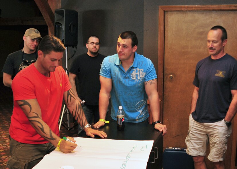 Men break up into a group to list the top ten annoying things their spouses do during a marriage retreat at Silver Mountain Resort in Kellogg, Idaho, Aug. 24, 2013. Key topics discussed during the retreat were communication, family traditions and conflict resolution. (U.S. Air Force photo/Staff Sgt. Michael Means)