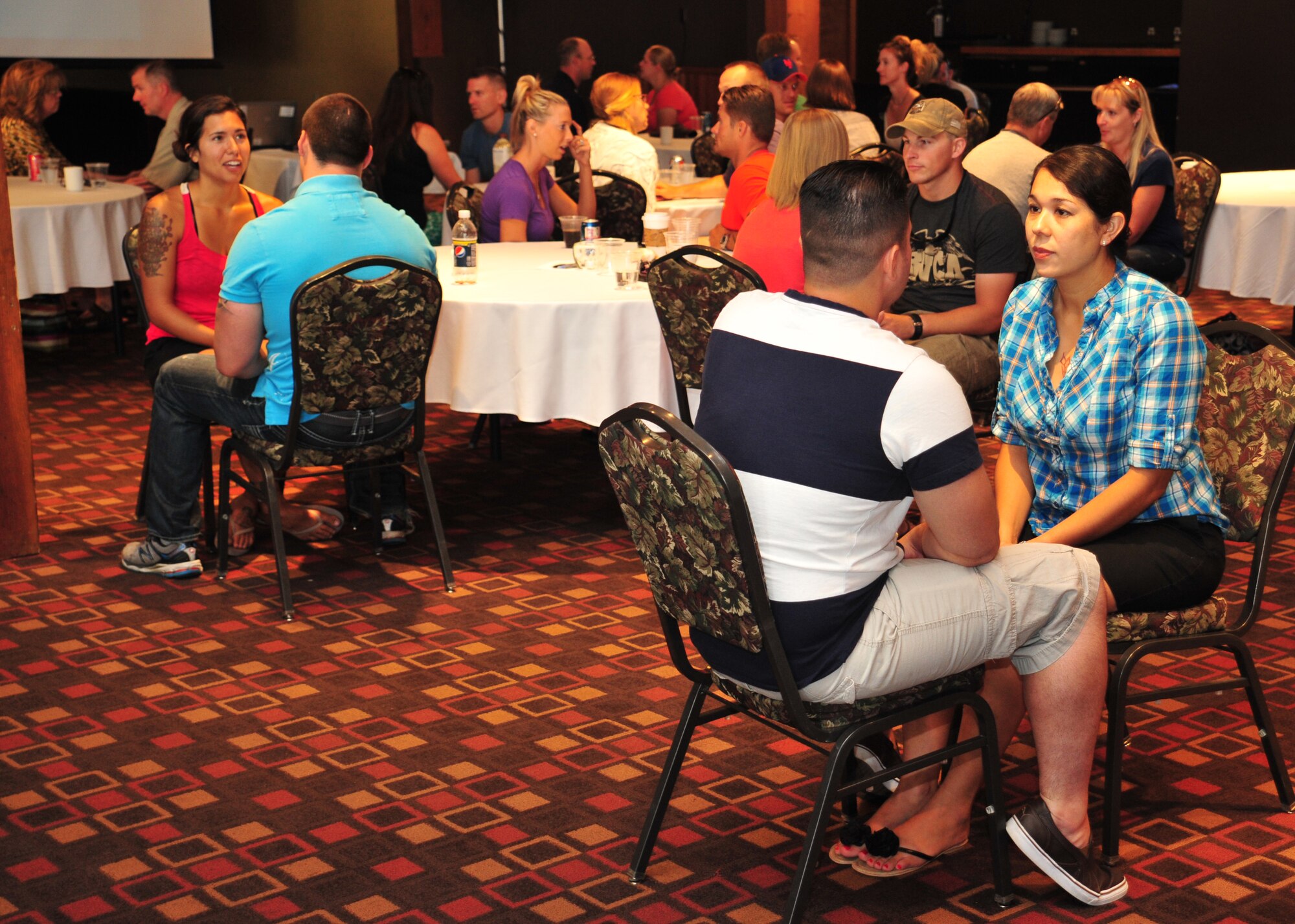 Members of the 336th Training Group and their spouses break away after a group discussion to practice communication skills they learned at Silver Mountain Resort in Kellogg, Idaho, Aug. 24, 2013. The purpose of the marriage retreat was to build resilient marriages by creating an environment where couples could focus on their relationships and bring attention to how they might be able to improve their marriage. (U.S. Air Force photo by Staff Sgt. Michael Means/Released)