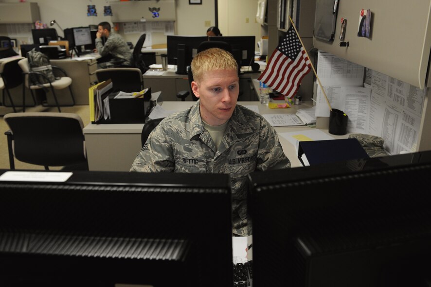 Senior Airman Andrew Retting, 2nd Comptroller Squadron budget analyst, reviews a document for the end-of-year closeout on Barksdale Air Force Base, La., Aug. 28, 2013. In order for mission essential organizations to acquire the items they need to complete the mission, 2nd CPTS Airmen work diligently ensuring these units get the money they need. (U.S. Air Force photo/Senior Airman Benjamin Gonsier)