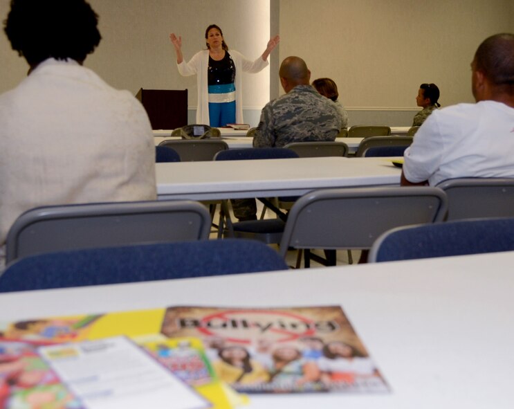 Lillian Holley, Behavior Interventionist Security with Bossier Parish Schools, speaks with Team Barksdale members during an anti-bullying conference on Barksdale Air Force Base, La., Aug. 22, 2013. Holley spoke about the different types of bullying and stated that there isn’t one profile that fits a bully. (U.S. Air Force photo/Staff Sgt. Amber Corcoran)