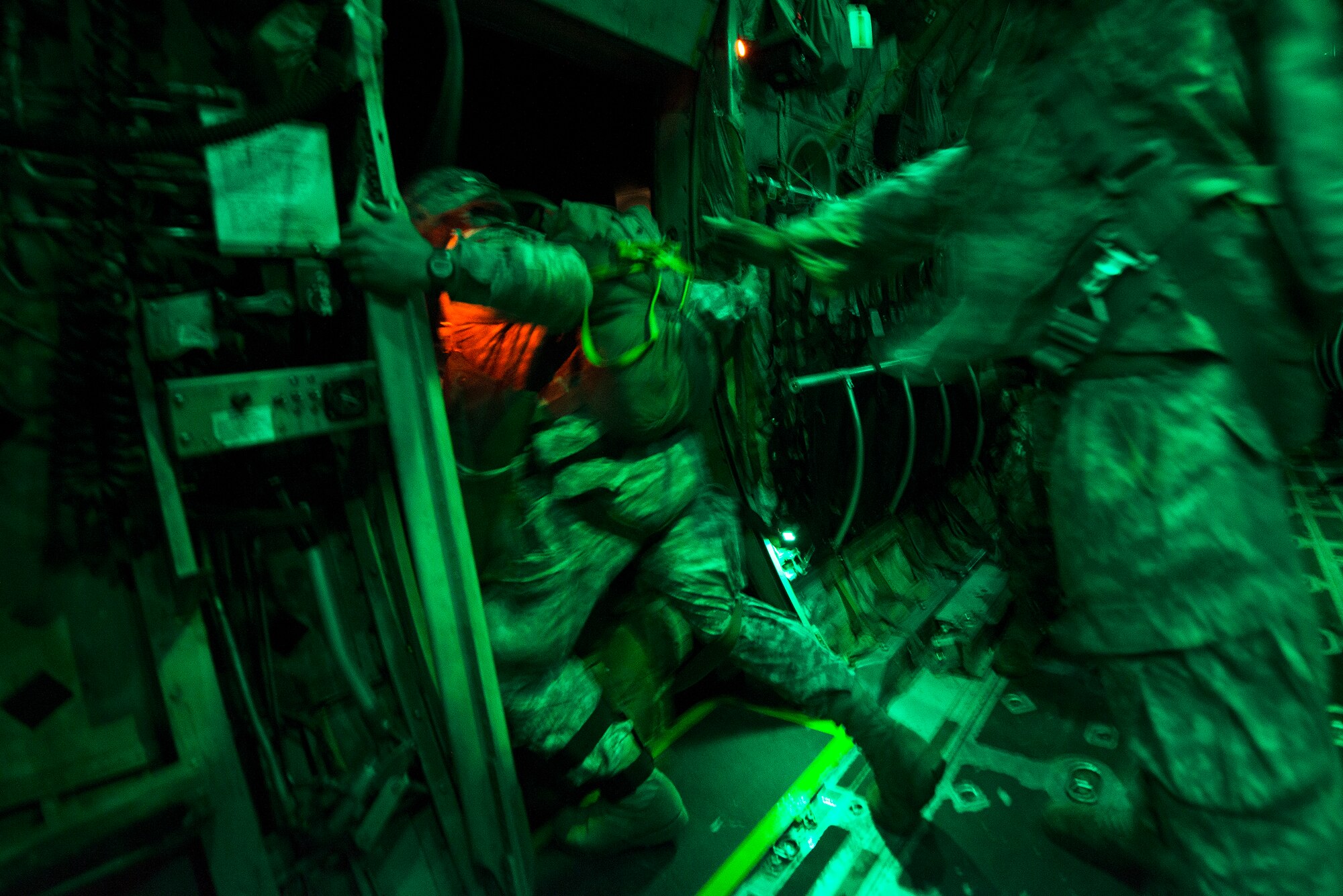 A U.S. Army paratrooper from the 82nd Airborne Division performs a pre-jump check, before exiting a C-130H Aug. 18, 2013, near Alexandria International Airport, La. The jump marked the start operations during Joint Operational Access Exercise 13-0X , part of a multi-day combined military training exercise designed to prepare Airmen and soldiers to respond to worldwide crises and contingencies. (U.S. Air Force photo by Staff Sgt. Russ Scalf)