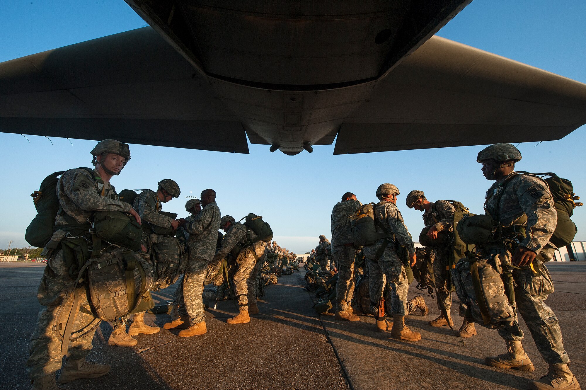 U.S. Army paratroopers from the 82nd Airborne Division perform an
equipment check before boarding a C-130H Aug. 18, 2013, at Alexandria
International Airport, La. The paratroopers were conducting a
static line drop that marked the beginning of Joint Operational Access
Exercise 13-0X. (U.S. Air Force photo by Staff Sgt. Russ Scalf)