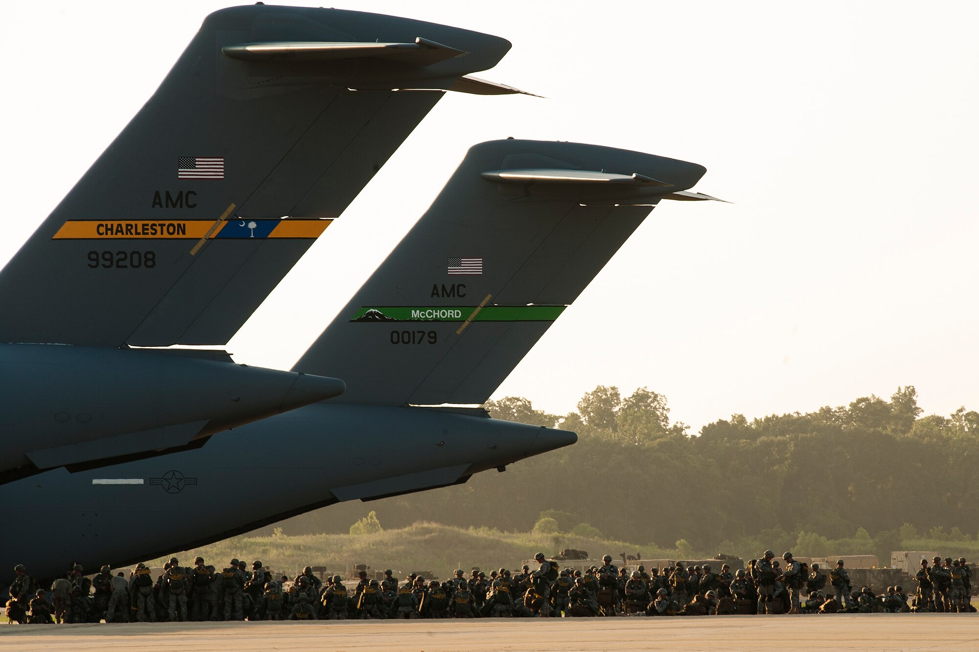 U.S. Army paratroopers from the 82nd Airborne Division wait to board C-17 Globemasters Aug. 18, 2013, at Alexandria International Airport, La. The paratroopers were conducting static line jumps as part of Joint Operational Access Exercise 13-0X. (U.S. Air Force photo by Staff Sgt. Russ Scalf)