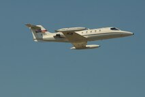 U.S. Air Force C-21 pilots Col. Brad Derrig, the 119th Wing vice commander, and Col. Kent Olson, the 119th Wing commander, make one final pass in C-21 aircraft number 84-0064 during its final flight from the North Dakota Air National Guard base in Fargo, N.D., Aug. 27, 2013. (U.S. Air National Guard photo/Senior Master Sgt. David H. Lipp, 119th Wing Public Affairs)