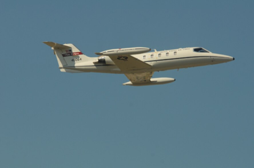 U.S. Air Force C-21 pilots Col. Brad Derrig, the 119th Wing vice commander, and Col. Kent Olson, the 119th Wing commander, make one final pass in C-21 aircraft number 84-0064 during its final flight from the North Dakota Air National Guard base in Fargo, N.D., Aug. 27, 2013. (U.S. Air National Guard photo/Senior Master Sgt. David H. Lipp, 119th Wing Public Affairs)