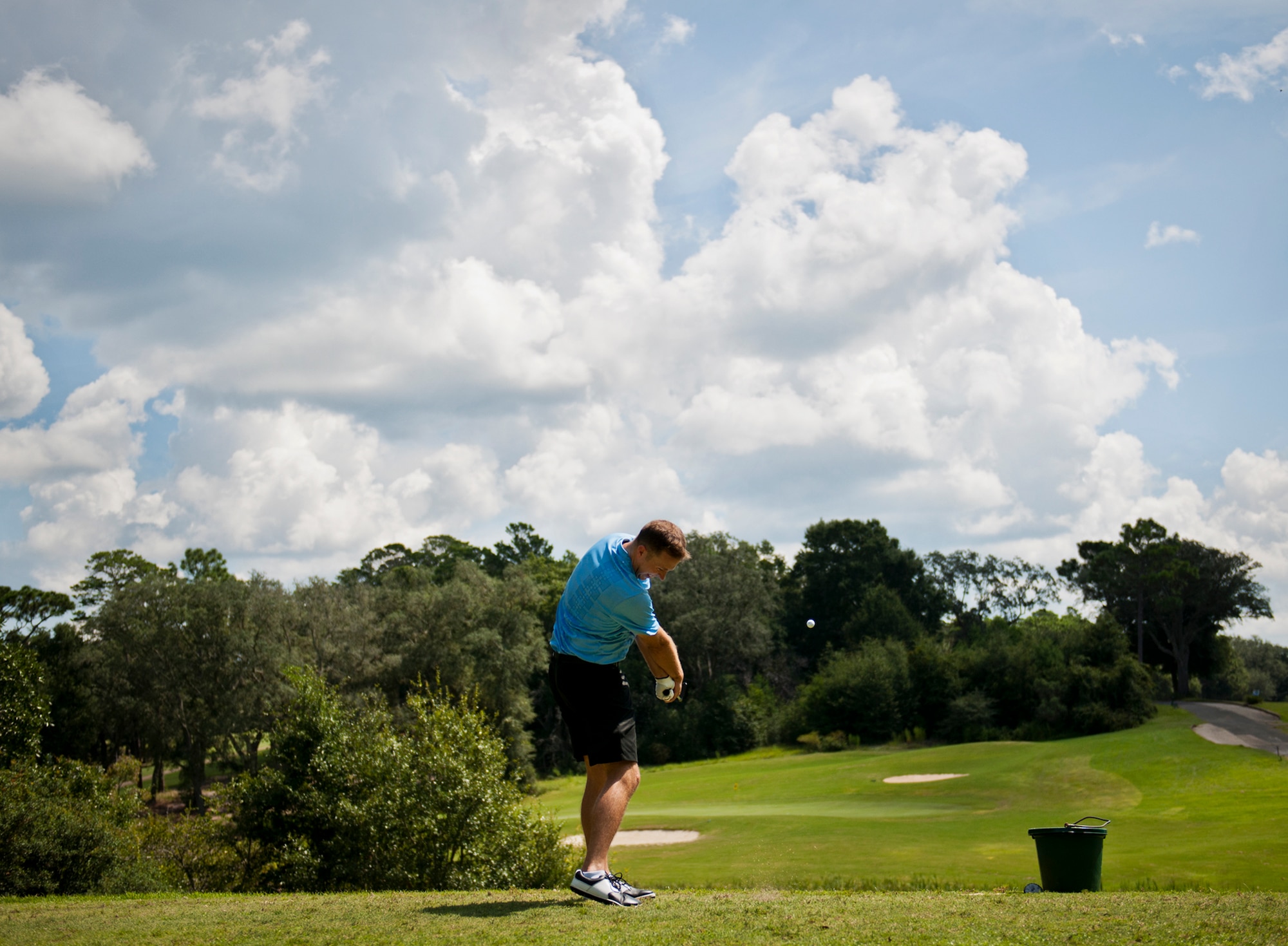 Trevor Bliven, of the 36th Electronic Warfare Squadron, takes a swing at the Par 3 second hole of the base intramural golf championship Aug. 28 at the Eglin Golf Course.  The 36th EWS competed against the 53rd Wing and were tied after 18 holes.  The 36th EWS team won the sudden death playoff on the first hole to claim the championship.  (U.S. Air Force photo/Samuel King Jr.)